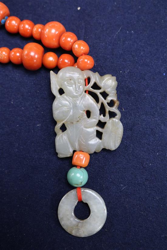 A carved jade, coral and hardstone bead necklace with silver gilt clasp, 32in.